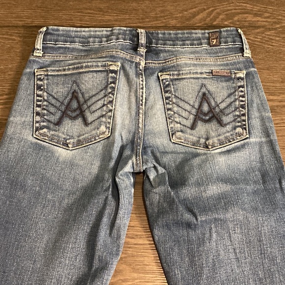 7 for all mankind boot cut flare jeans. Size 27. Medium wash. Faded front. - Picture 10 of 16